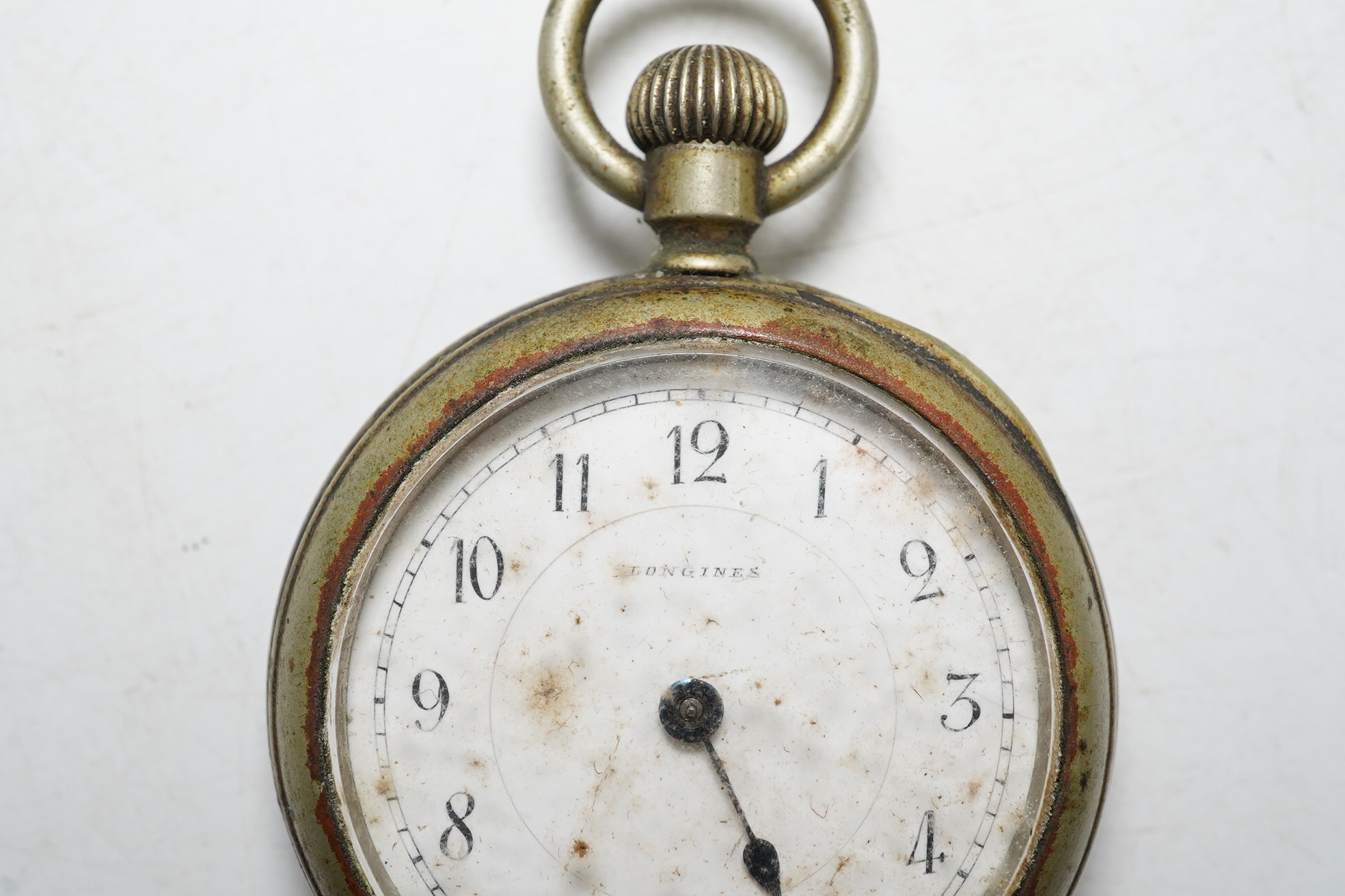 An early 20th century Longines base metal keyless pocket watch. Condition - poor, movement not going